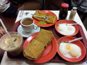 Ya Kun Kaya Toast breakfast set - 2 soft-boiled eggs, kaya toast, french toast, and kopi (coffee)